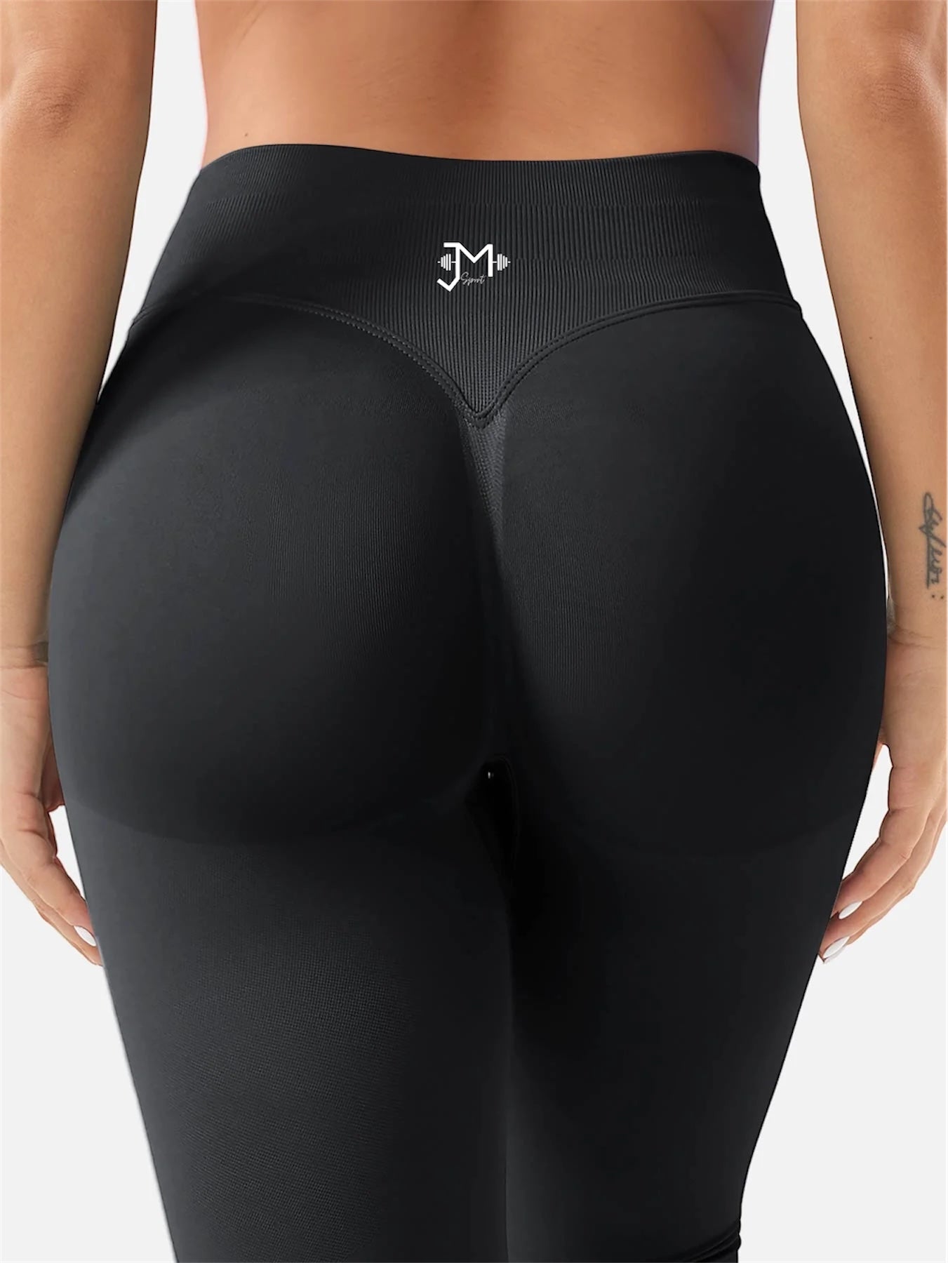 Leggings deportivos push up premium negros, vista trasera, cintura alta y fruncido oculto que realza glúteos